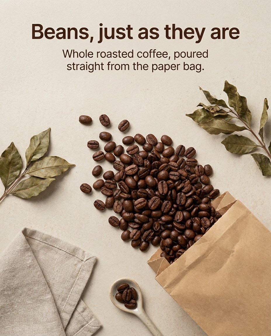Flat lay of coffee beans spilling from a paper bag among dried leaves, headline "Beans, just as they are"