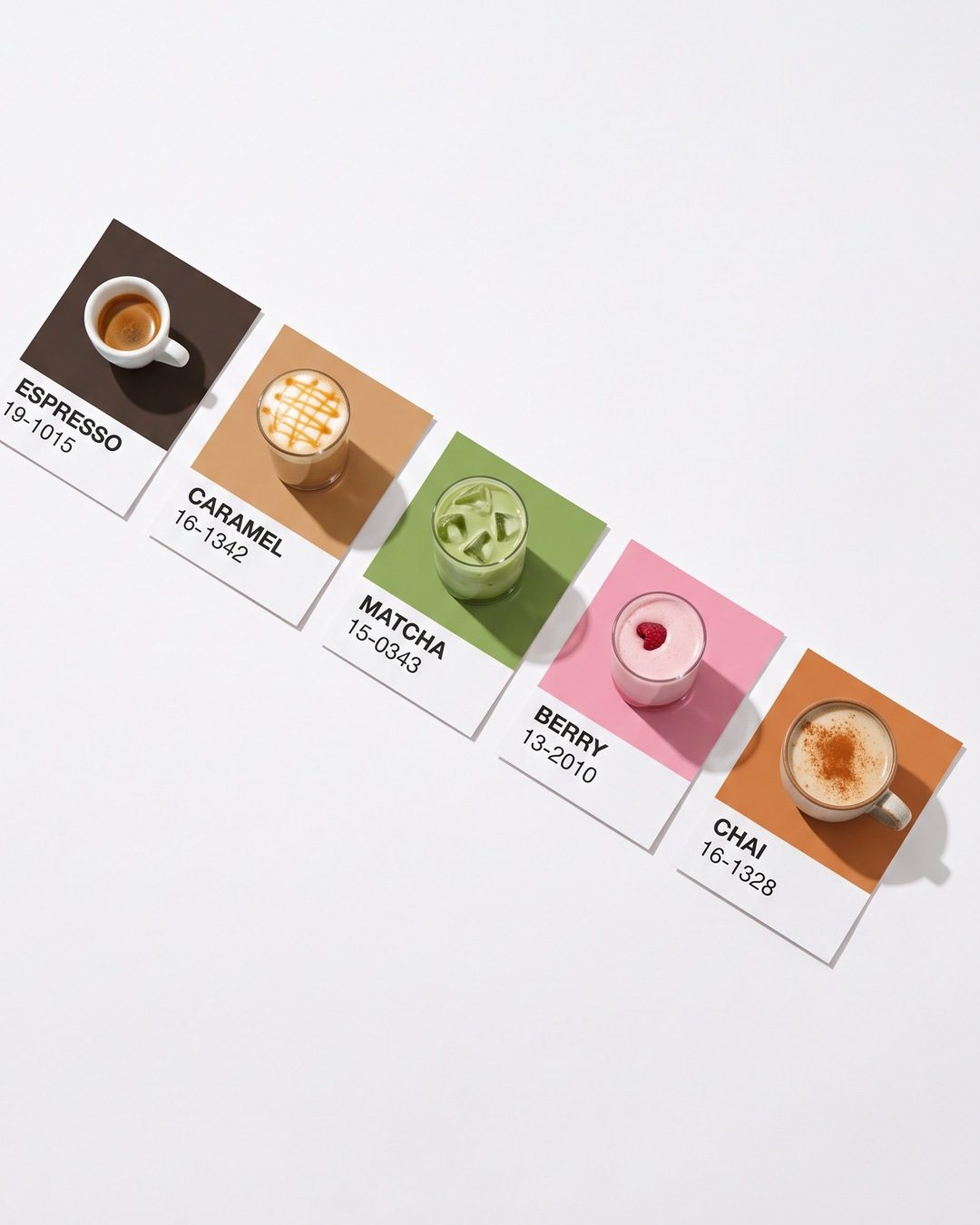 Five coffee drinks seen from above, each on a colour swatch card in its own shade, from espresso to chai